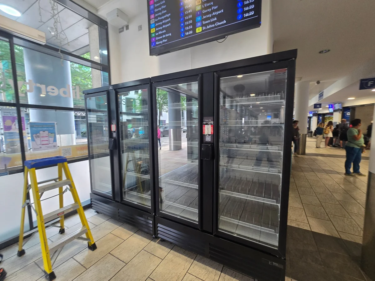 Double-door smart coolers positioned at a customer location during installation